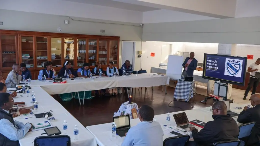 Board of governors, management and staff seated for a full-day strategic planning workshop